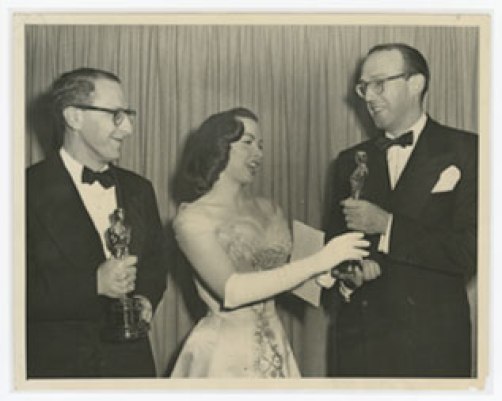 Ray Evans and Jay Livingston receiving their Academy Awards from Kathryn Grayson in for 'Mona Lisa'.